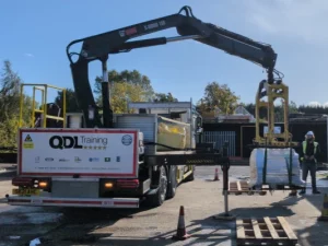 Lorry loader lifting bricks